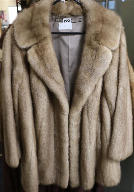 A brown three-quarter mink jacket